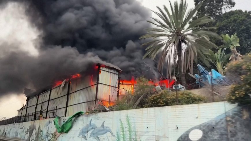 Iranian missile strike in central Israel sets building ablaze